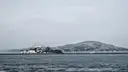 Alcatraz with Angel Island behind it, seen across the bay
