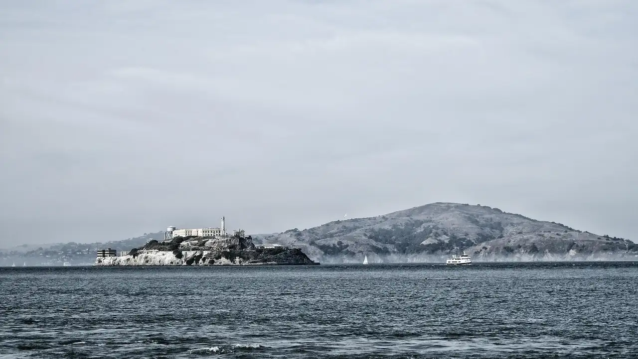 Alcatraz with Angel Island behind it, seen across the bay