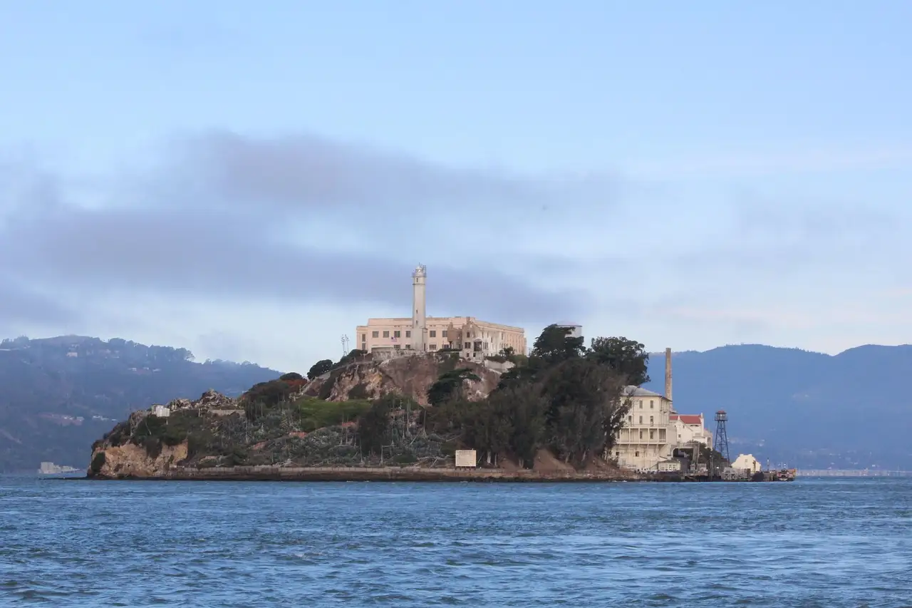 Alcatraz Island seen across the water of San Francisco Bay in daylight