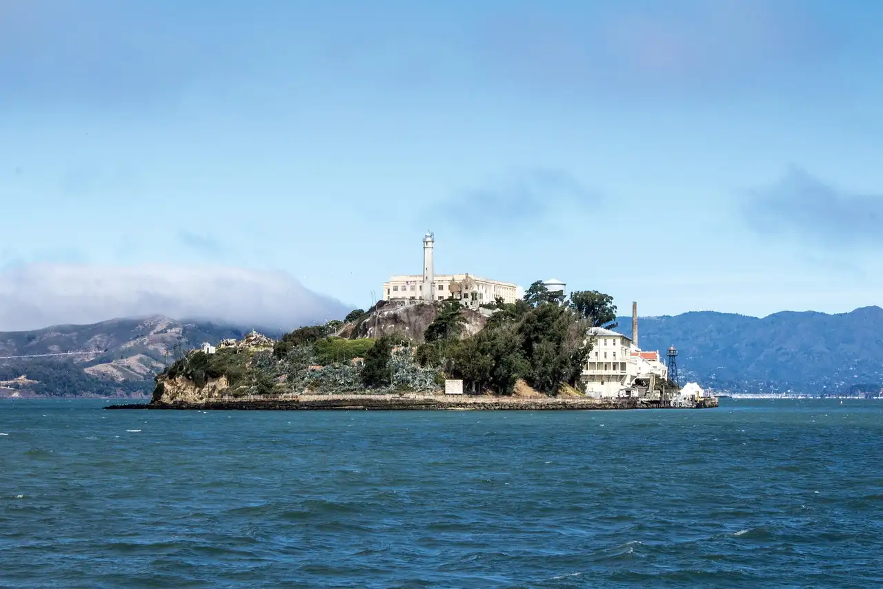 Alcatraz Island on a sunny day, seen from the bay