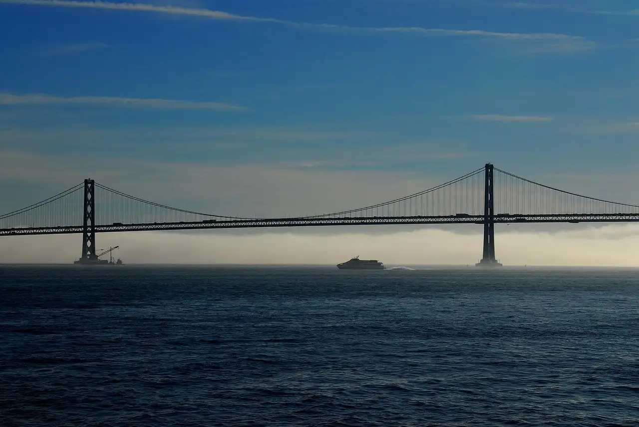 The Bay Bridge over the water on a hazy morning