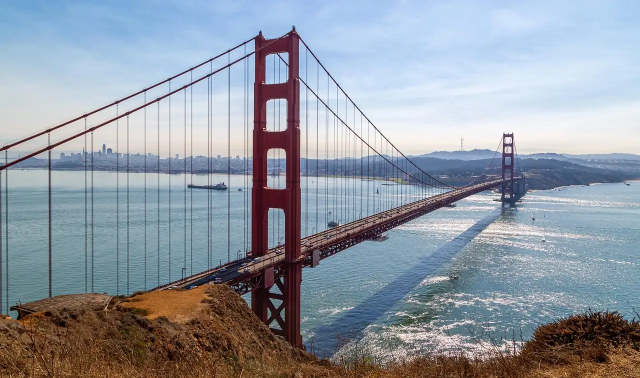 The Golden Gate Bridge on a bright day with blue water and sky