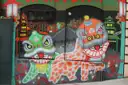 A mural of two lion-dance dragons on a wall in Chinatown