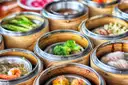 Several baskets of dim sum on a table