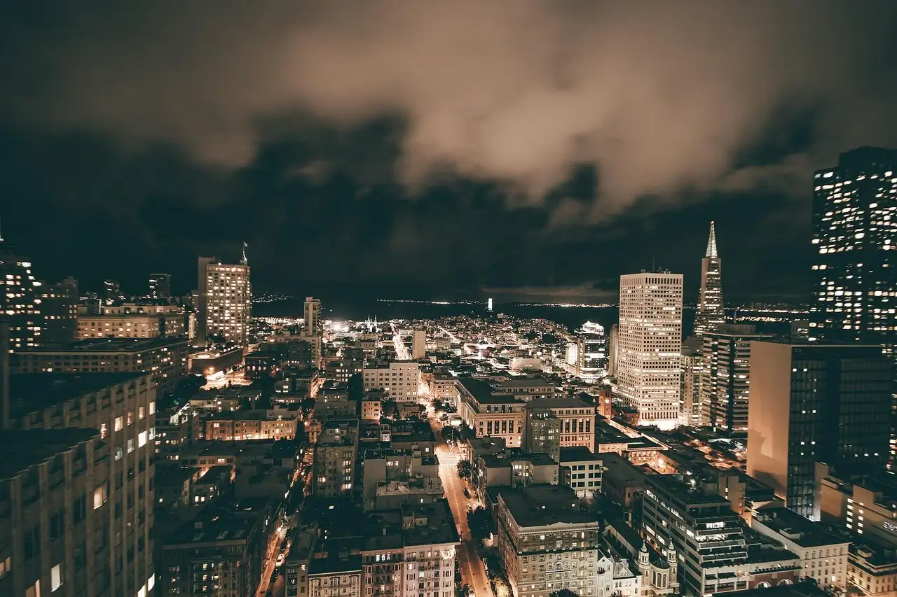 Downtown San Francisco at night under low clouds