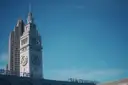The clock tower of the Ferry Building on the San Francisco waterfront against a blue sky