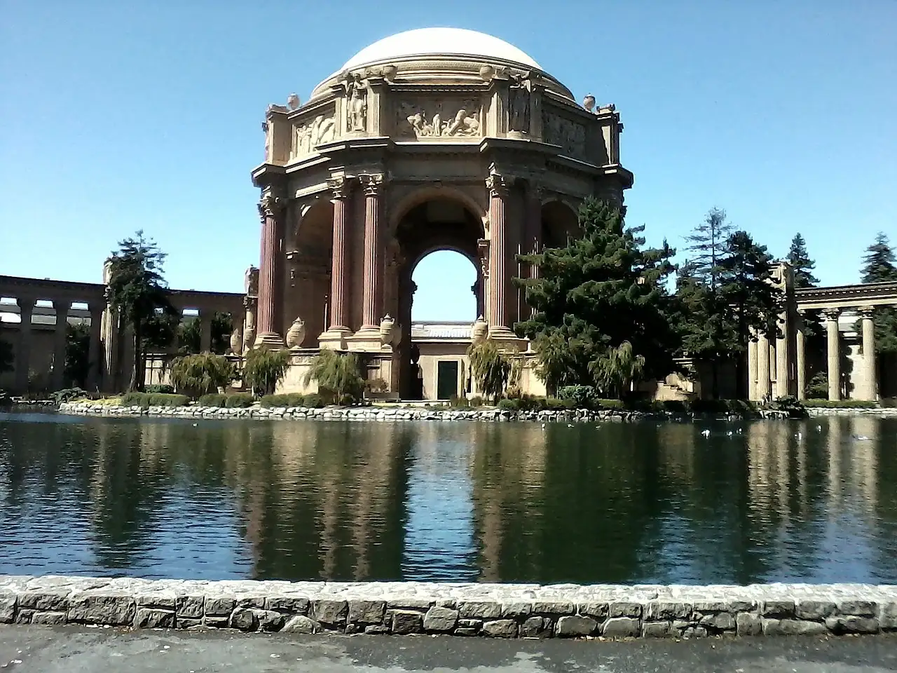 The Palace of Fine Arts rotunda reflected in its lagoon in San Francisco