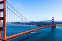 The Golden Gate Bridge across the blue bay, with the city behind