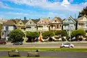 Colourful Victorian houses facing a park in a San Francisco neighbourhood