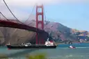 A ship sailing under the Golden Gate Bridge