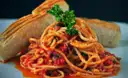 Spaghetti in tomato sauce with toasted bread