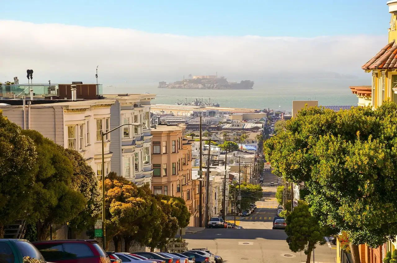 A San Francisco street running down toward the bay and Alcatraz