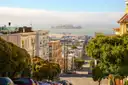 A San Francisco street running down toward the bay and Alcatraz