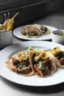 A plate of tacos al pastor