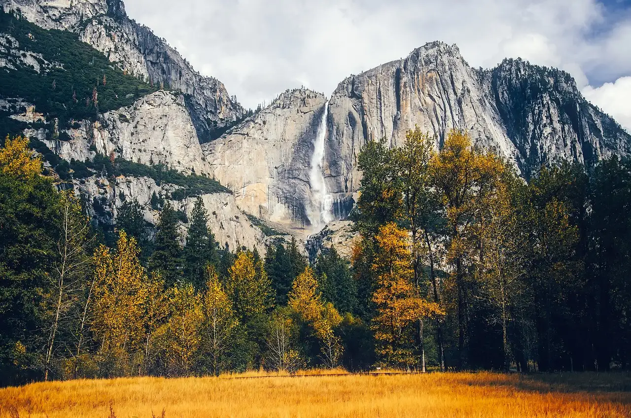 Yosemite Falls above a meadow in autumn